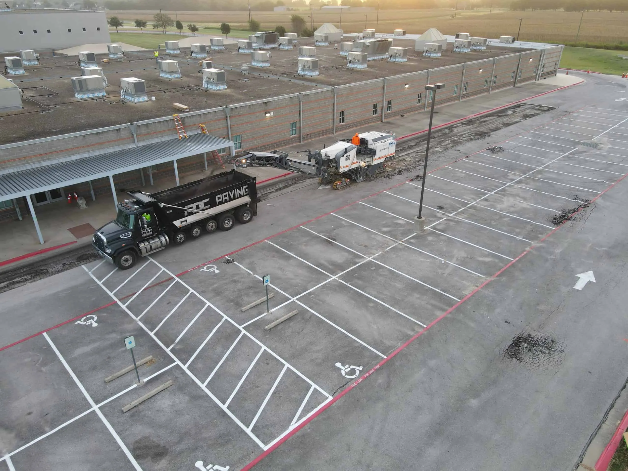 Read more about the article What Property Managers Need to Know About Asphalt Paving
