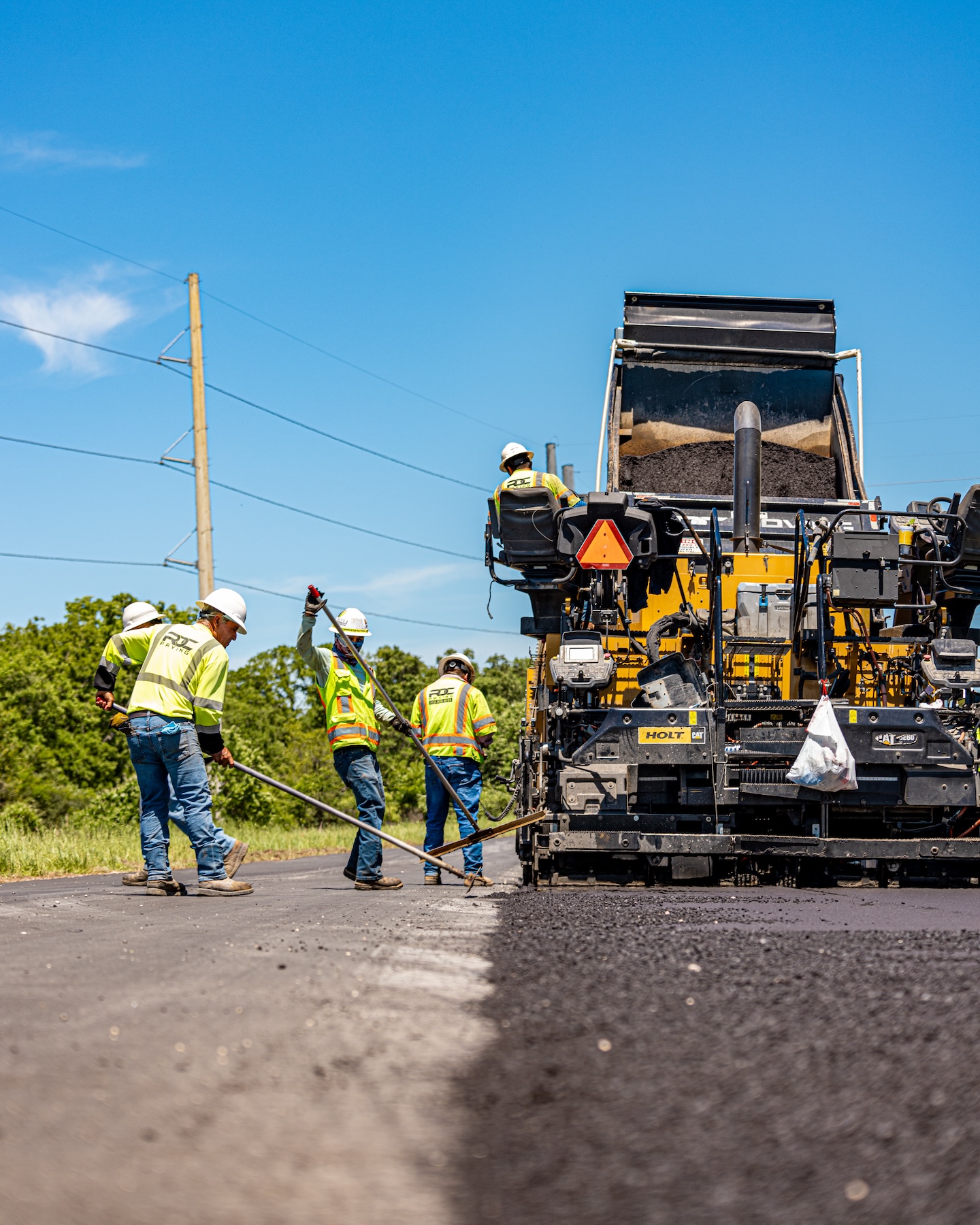 RDC paving employees repaving a road