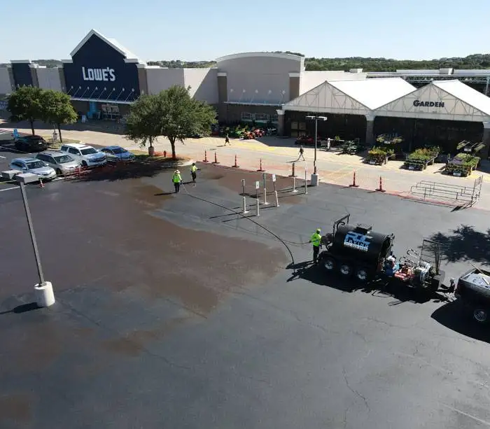 Asphalt sealcoating