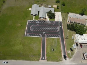 Parking lot with new striping and directional arrows.