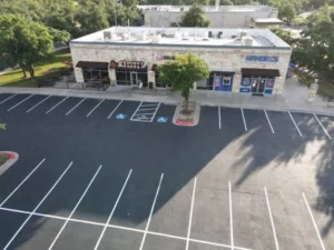 A local business center gets new striping and ADA compliance spaces.