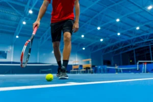 tennis player in sports facility completed by sports construction company RDC Paving