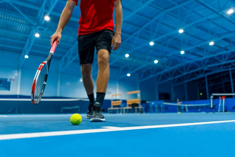 tennis player in sports facility completed by sports construction company RDC Paving