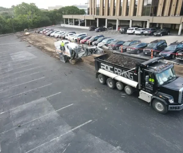 RDC Trucks hauling away asphalt during milling