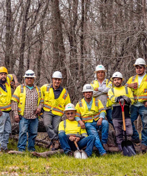 RDC Team posing in front of trees.