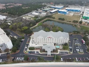 A hotel parking lot gets complete redone with new striping and asphalt.