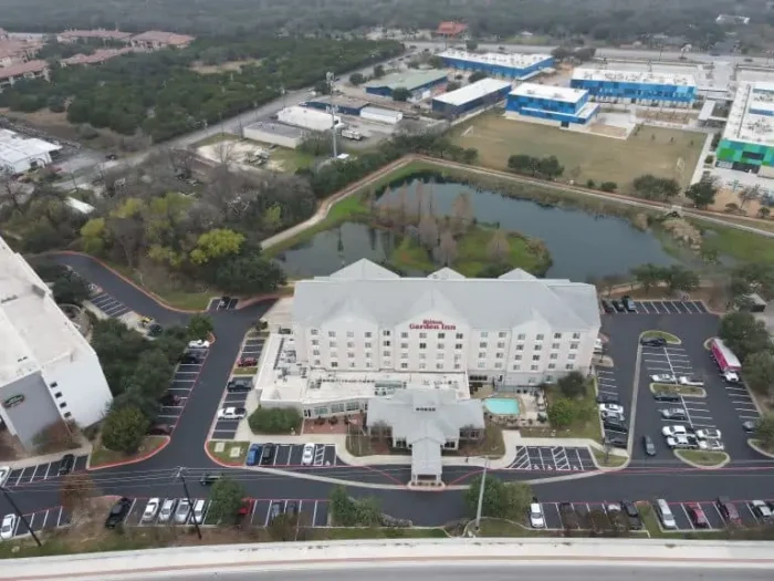 A hotel parking lot gets complete redone with new striping and asphalt.