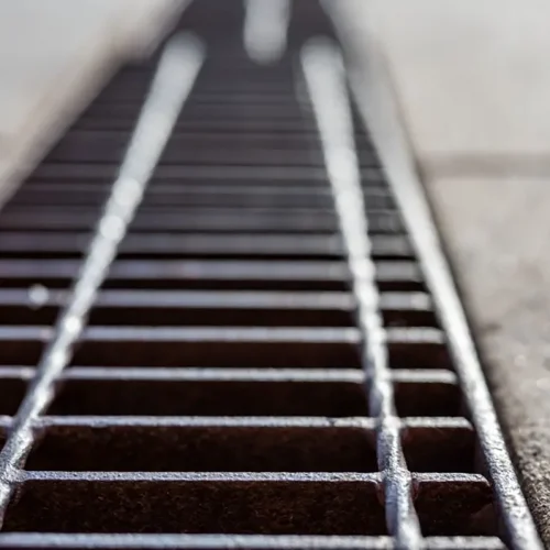 A close up of a storm drain