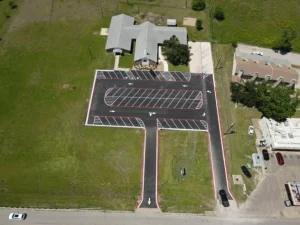 Parking lot with new striping and directional arrows.